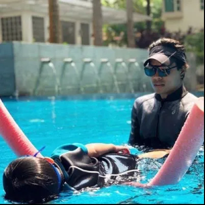 Image Swimming Lessons with Coach Nicholas.