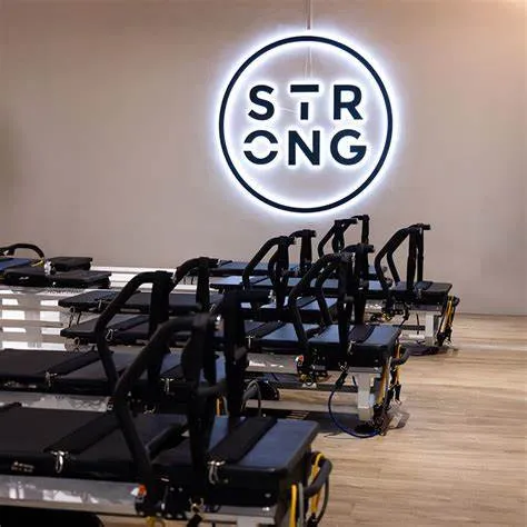 Image A premium Orchard Road studio offering efficient, cardio-infused Pilates workouts in a luxe, café-style setting.