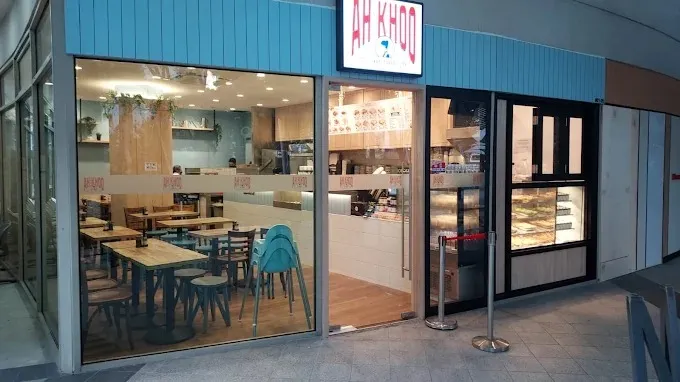 Image a Singaporean cafe specializing in traditional toast sets, coffee, and local dishes