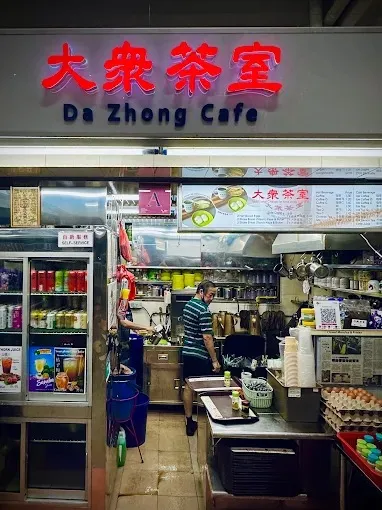 Image a popular hawker stall in Singapore known for its traditional Nanyang-style coffee, tea, and kaya toast breakfast sets